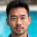 Portrait of Coach David Lim, focused and professional