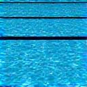 Clear blue swimming pool water with lane lines visible.